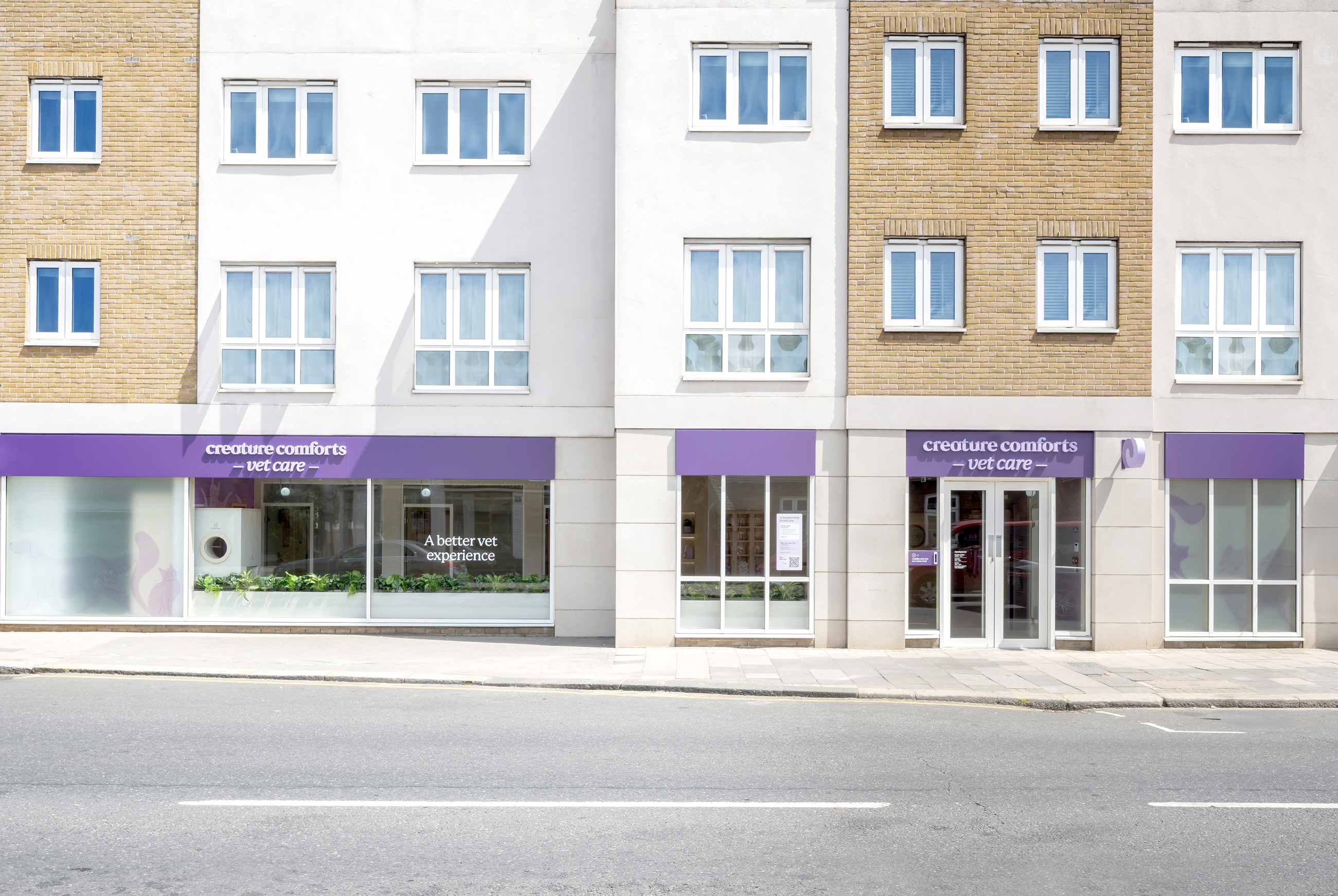 Front view of Creature Comforts Putney, featuring modern architecture and purple signage.